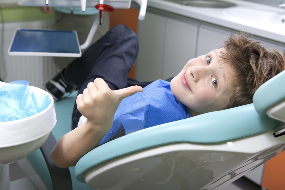 kid sitting in a dental chair