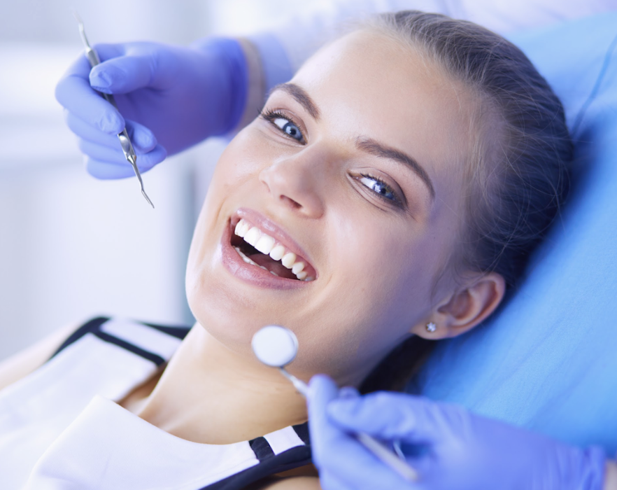 woman getting dental cleaning